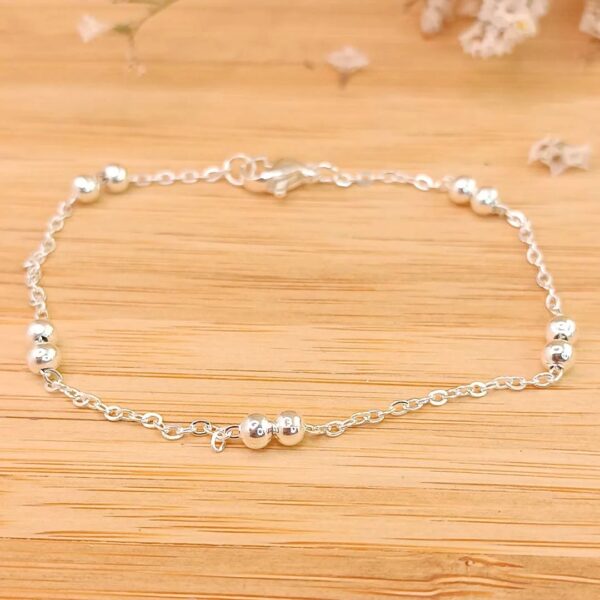 Pulsera cadena forzada + doble Bolitas